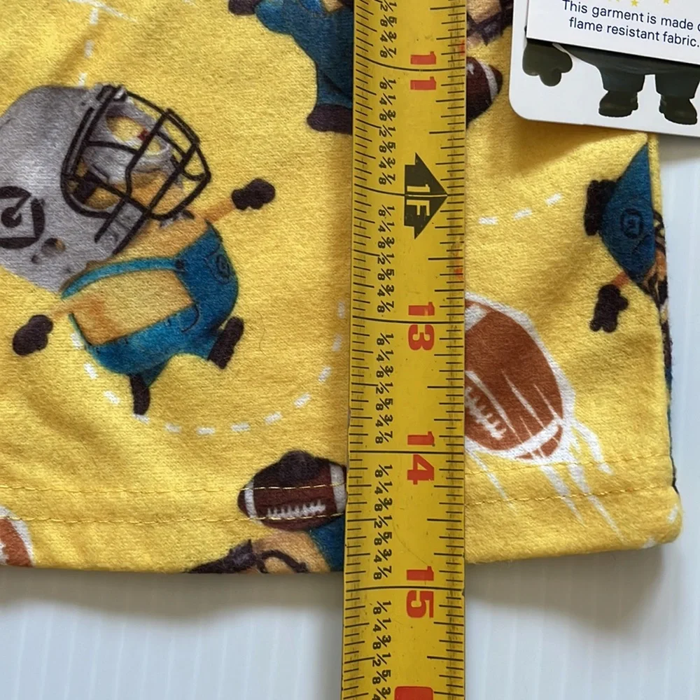 Minions yellow football pajama top & bottoms.  Size 4
